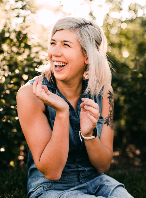 A woman feeling happy after taking cordyceps mushroom for energy.
