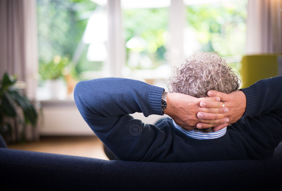 A man lounging after taking matcha for relaxation.