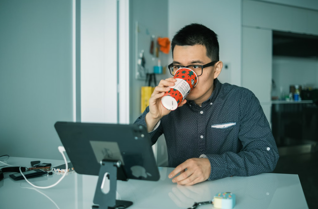 A man drinking organic Chaga mushroom powder.