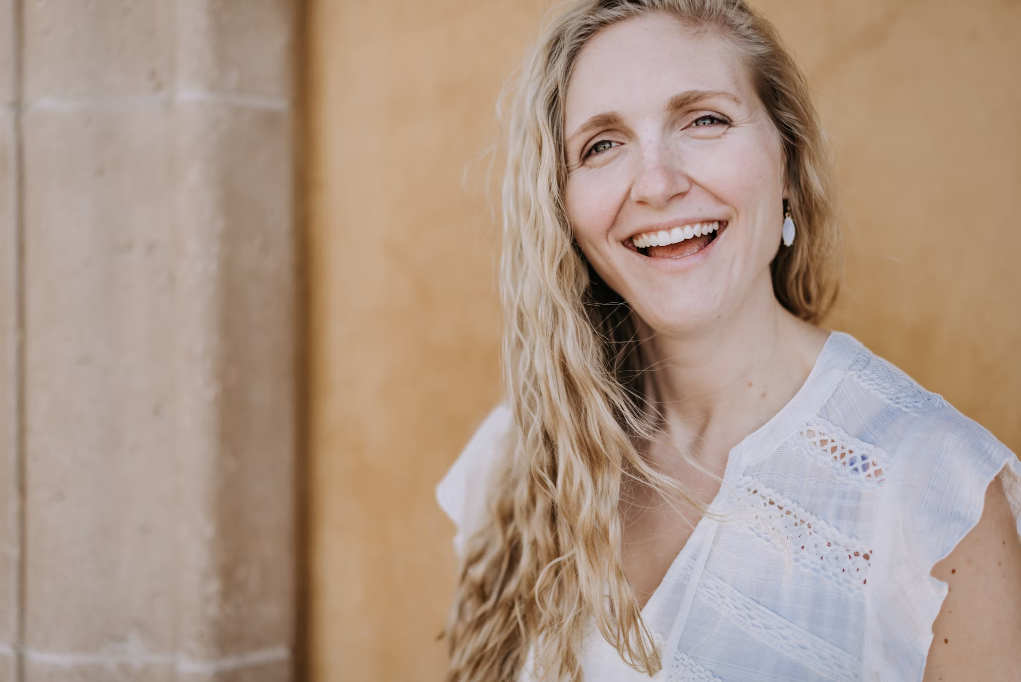 A woman feeling fresh after having lavender matcha latte.