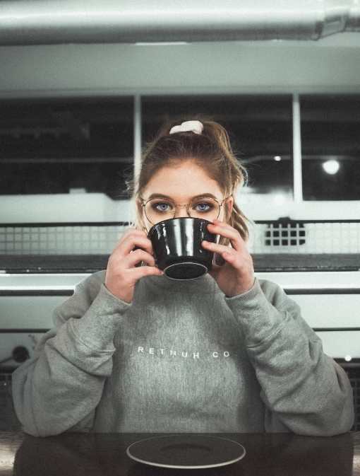 A woman drinking Chaga mushroom coffee.